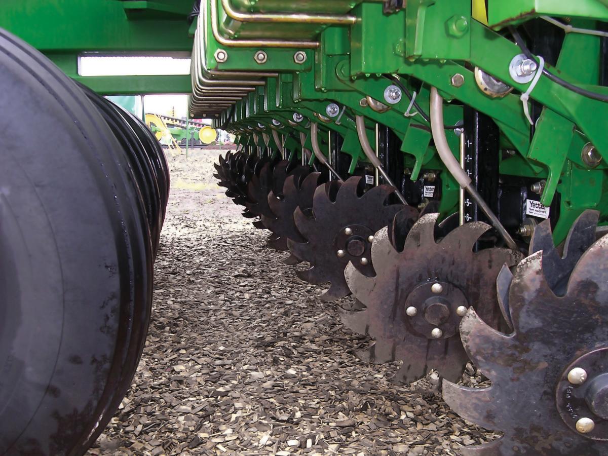 Side view of multiple 2967 Screw Adjust Row Cleaners in the field